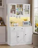 A white kitchen cabinet with glass doors and shelves, containing various items like jars, bottles, and a microwave. It is illuminated by warm LED lights. Voir les images du produit