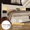 A bedroom scene featuring a bed with a headboard that has integrated lighting and charging capabilities. Produktbild-Vorschau