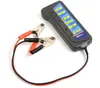 A car battery and alternator tester with alligator clips is shown on a white background. Náhled obrázku produktu