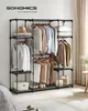 A well-organized open wardrobe with clothes and accessories displayed. Produktbild-Vorschau
