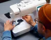 A person sewing with a Brother sewing machine. Produktbild-Vorschau