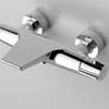A close-up, studio shot of a chrome shower thermostat mounted on a wall. Produktbild-Vorschau