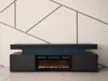 A modern black TV stand with an integrated electric fireplace and blue LED lighting, set against a white wall with geometric metal accents. Produktbild-Vorschau