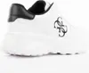 A side view of a white Guess sneaker with black accents. Produktbild-Vorschau