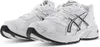 A pair of white and black Asics running shoes. Produktbild-Vorschau