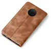 A brown leather flip case for a smartphone is shown against a white background. Produktbild-Vorschau