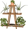 A wooden plant stand with several potted plants on it, set against a white background. Produktbild-Vorschau