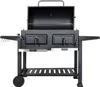 A black charcoal grill with its lid open, shown from the front on a white background. Produktbild-Vorschau