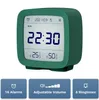 A green digital alarm clock is shown with its features highlighted in blue boxes below. Podgląd zdjęcia produktu