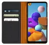 A flip case wallet for a smartphone, showing the inside with card slots and the phone screen displaying a colorful abstract wallpaper. Náhľad obrázku produktu