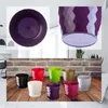 A collage of images showing various colorful plastic plant pots with saucers, and close-ups of two purple pots. Podgląd zdjęcia produktu