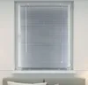 A close-up view of a window with silver blinds. Produktbild-Vorschau