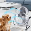 A dog is sitting in front of a fan, with blue lines indicating airflow. Voir les images du produit