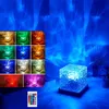 A collage of product images showing different color options and a main image of the product in a room with projected light. Produktbild-Vorschau