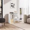A white cube storage unit with shelves, filled with books and organizers, placed on a wooden floor next to a sofa and window with white curtains. Náhľad obrázku produktu