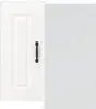 A close-up view of a white kitchen cabinet door with a black handle, positioned next to a light gray surface. Voir les images du produit