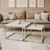 A living room scene with a sofa, coffee tables, and artwork. Produktbild-Vorschau