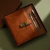 A vintage-style A5 notebook with a combination lock and two pens, presented in a gift box. Náhľad obrázku produktu