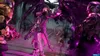 A group of characters in a video game setting, with one character in the foreground casting purple energy. Produktbild-Vorschau