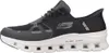 A side view of a black Skechers sneaker. Voir les images du produit