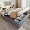 A bed with its storage compartment open, revealing stored items. Náhled obrázku produktu