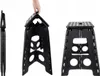 A black folding stool is shown in three different views: folded, partially open, and fully open. Náhled obrázku produktu