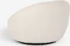 A close-up view of a white bouclé armchair from the side, showing its textured fabric and curved shape. Produktbild-Vorschau