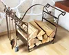 A metal firewood rack filled with logs and a set of fireplace tools. Podgląd zdjęcia produktu