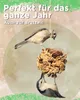 Two birds are shown feeding from a bird feeder made of seeds and pine cones, hanging from a string. Produktbild-Vorschau