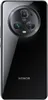 The back of a black Honor smartphone is shown against a black background. Podgląd zdjęcia produktu