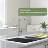 A modern kitchen sink with a faucet, dish drying rack, and fruit. Produktbild-Vorschau