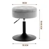 A gray upholstered stool with a black adjustable base, shown against a white background with measurement indicators. Produktbild-Vorschau