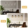 A collage showing a dining table with pendant lights above it, both when the lights are off and on. The top image shows the lights off, and the bottom image shows them on, illuminating the room. Podgląd zdjęcia produktu