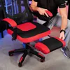 A person is adjusting a gaming chair with a footrest. Produktbild-Vorschau