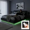 A woman is reading a book in a modern bedroom with a bed that has LED lighting. Produktbild-Vorschau
