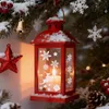 A festive Christmas scene with a red lantern, ornaments, and snow. Produktbild-Vorschau