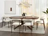 A dining room setting with a table and chairs. Voir les images du produit