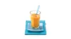 A glass of orange juice with a straw on a blue coaster and napkin. Náhľad obrázku produktu