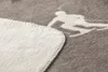 A close-up view of a folded blanket with a skier graphic. Produktbild-Vorschau