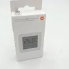 A white product box with a digital display showing temperature and humidity readings. Podgląd zdjęcia produktu