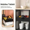 A kitchen cart with fruit in the trays and cups on the lower shelf, with text overlay describing a mobile tray. Voir les images du produit