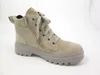 A single beige boot against a white background. Produktbild-Vorschau