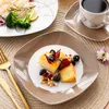 A table setting with plates of food and a cup of coffee. Náhled obrázku produktu