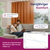 A couple relaxing on a couch in a living room with a window showing a rainy street scene. The image highlights the benefits of curtains. Produktbild-Vorschau