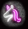 A neon unicorn sign mounted on a brick wall. Anteprima dell’immagine prodotto