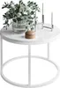 A white round coffee table with a vase of flowers, a wooden trinket box, and a candelabra. Náhľad obrázku produktu