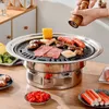 A person is using a pepper grinder over a Korean BBQ grill filled with various foods like meat, sausages, and corn. Náhled obrázku produktu