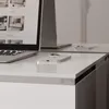 A close-up view of a desk with a laptop and a smartphone. Produktbild-Vorschau