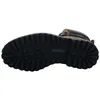 The sole of a brown and black boot is shown against a white background. Anteprima dell’immagine prodotto