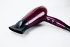 A purple and black hair dryer is shown on a white background. Podgląd zdjęcia produktu